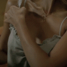 Jessica Alba removing her bra